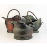Three copper coal helmets.
