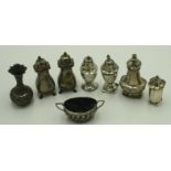 Six various silver pepper pots, an open silver mustard, 10.