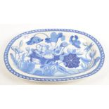 A Wedgwood blue and white oval meat dish, 19th century, foliate decorated, 31.2 x 42cm.