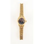 A Rolex lady's Oyster Perpetual datejust 18ct gold wrist watch with diamond markers and blue dial