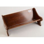 A Globe Wernicke mahogany book trough, metal maker's label to reverse, height 15.5cm, width 40.5cm.