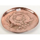 An Arts and Crafts copper tray, stamped 'NEWLYN', repousse decorated with stylised fish,