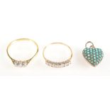 A three stone diamond ring, one other gold ring and a small gold heart locket set with turquoise.