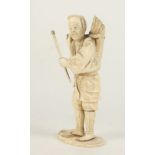 A Japanese ivory sectional okimono of a worker, 19th century, signed to the base, height 15cm,