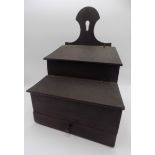An oak candle box, with two hinged covers above a single drawer, height 45.5cm, width 34cm.