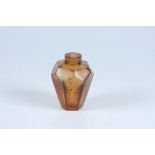 An amber glass snuff bottle with gold flake inclusions, height 6.4cm.