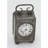A miniature planished silver cased carriage clock with French movement, Birmingham 1905,