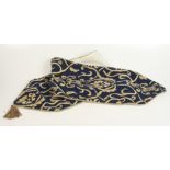 A navy and gold brocade pulpit fall, 176 x 33cm and a wooden and brass candle snuffer, length 92.