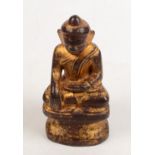A South East Asian gilt bronze figure of a seated buddha, 19th century or earlier, height 15cm,