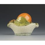 A rare Whieldon type 18th century model of an apple in a basket,