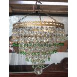 A cut glass and gilt metal hanging waterfall ceiling shade, with green and clear glass drops,