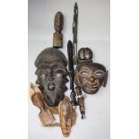 Two African masks and a quantity of carvings.