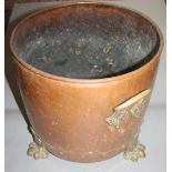 A copper coal bucket, circa 1900, with brass handles and on three paw feet, height 32cm,