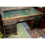 A mahogany pedestal desk, early 20th century, with an arrangement of nine drawers, height 77cm,