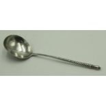 A Russian silver spoon with half twisted stem and urn finial,