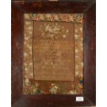 A needlework sampler depicting details of the Williams family from 1806 to 1889 and decorated with