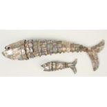 Two articulated mother of pearl models of fish, length 41cm and 13.5cm.