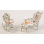 A Dresden style porcelain flower encrusted box, in the form of a chaise longue, length 20cm,