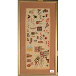 An unusual needlework sampler decorated with colourful geometric motifs and foliage,