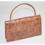 A light brown crocodile handbag, 19 x 31cm.