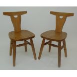 A pair of Robin Nance pine chairs.