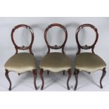 A set of seven Victorian mahogany balloon back dining chairs,