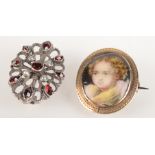 A gold mounted portrait brooch and a paste set brooch.