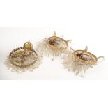 A pair of gilt metal and cut glass ceiling lights, height 34cm and another height 36cm.