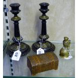 A pair of Victorian ebonised candlesticks with double knopped fluted tapering columns, fret work