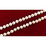 A single row cultured pearl necklace of uniform form comprising 75 x 7mm beads to a 9 carat gold and