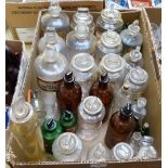 A box of pharmaceutical bottles most with stoppers