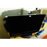 An LG 32" colour Television with remote with a smoked glass TV stand (2)