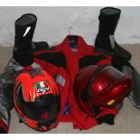 An RSR all-weather motorcycle jacket, a pair of all-weather boots, size 42, an AGV helmet, size M/