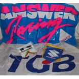 An Answer Racing PVC banner, a TGA flag, a Suzuki string pennants, two Yamaha string pennants and