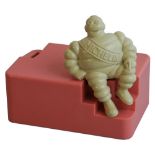 A rare pink Bakelite Michelin employee`s money box, circa 1950s-60s, the rectangular box with a