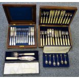 A mahogany canteen of cutlery together with a fish service in canteen, cased carving set and a cased