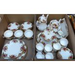 A Royal Albert Old Country Roses tea and dinnerware including a two tier cake plate, tea and