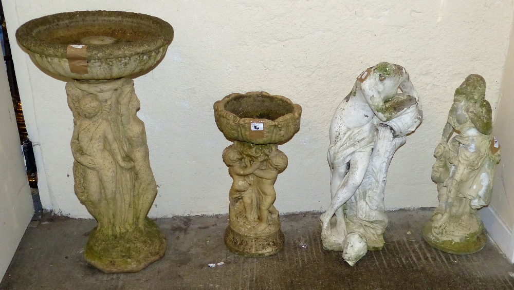 Two bird baths together with two stone garden figures, one with head detached (4)