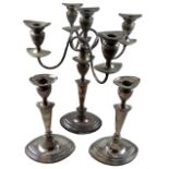 An electroplated four branch five light candelabra/ candlestick together with a pair of