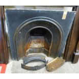 A cast iron fire inset together with grate and curb