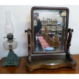 A Victorian mahogany swing toilet mirror, 60cm high, together with a Victorian table oil lamp with