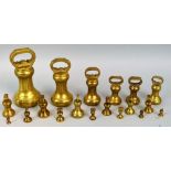 A Victorian set of butcher's brass bell weights to weigh 7lb to 4oz and two other later sets of