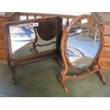 A mahogany swing toilet mirror with oblong panel and plain tapering supports, 42cm high and