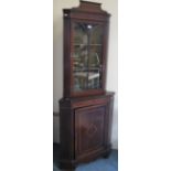 An Edwardian satinwood banded and inlaid mahogany standing corner cabinet with astragal glazed top