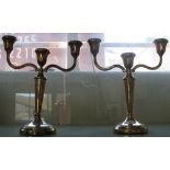 A silver pair of three light, two branch candelabra, Birmingham 1973, loaded