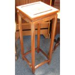 A 20th century Chinese hardwood plant stand with panelled square top and key pattern frieze, 80cm