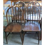 A set of four Ercol stick back kitchen chairs (4)