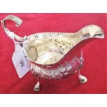 A George III silver sauce boat, London 1782, with embossed decoration, 3 oz