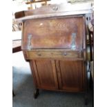 An Arts and Crafts oak bureau with cupboard under, 83cm wide