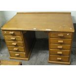 An oak double pedestal office desk, 128cm wide